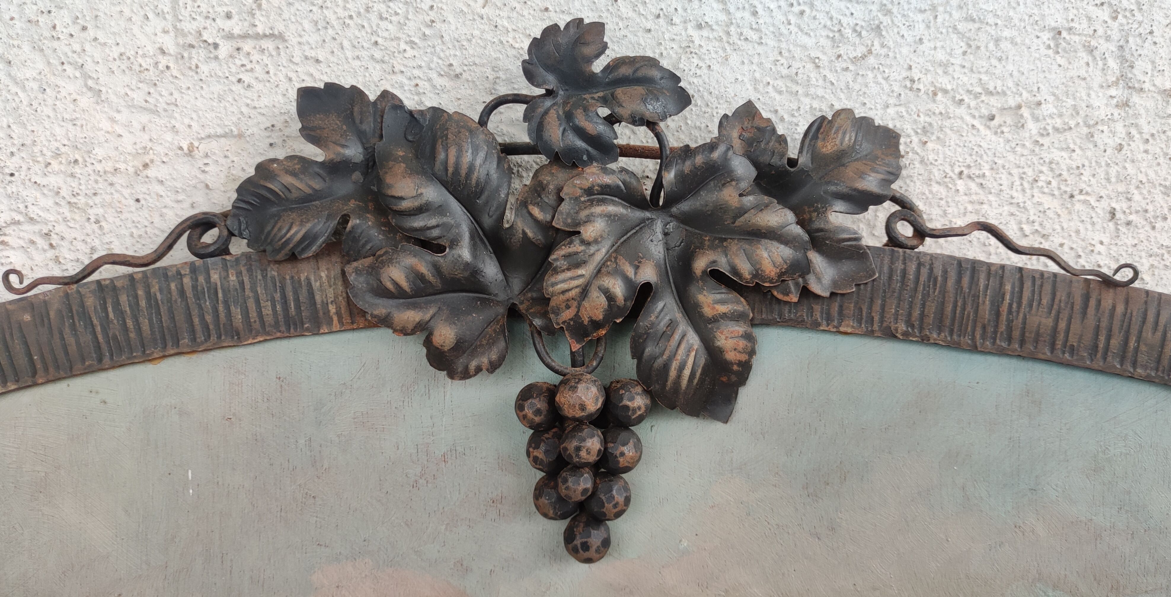 Old trumeau wrought iron decoration bunches grapes