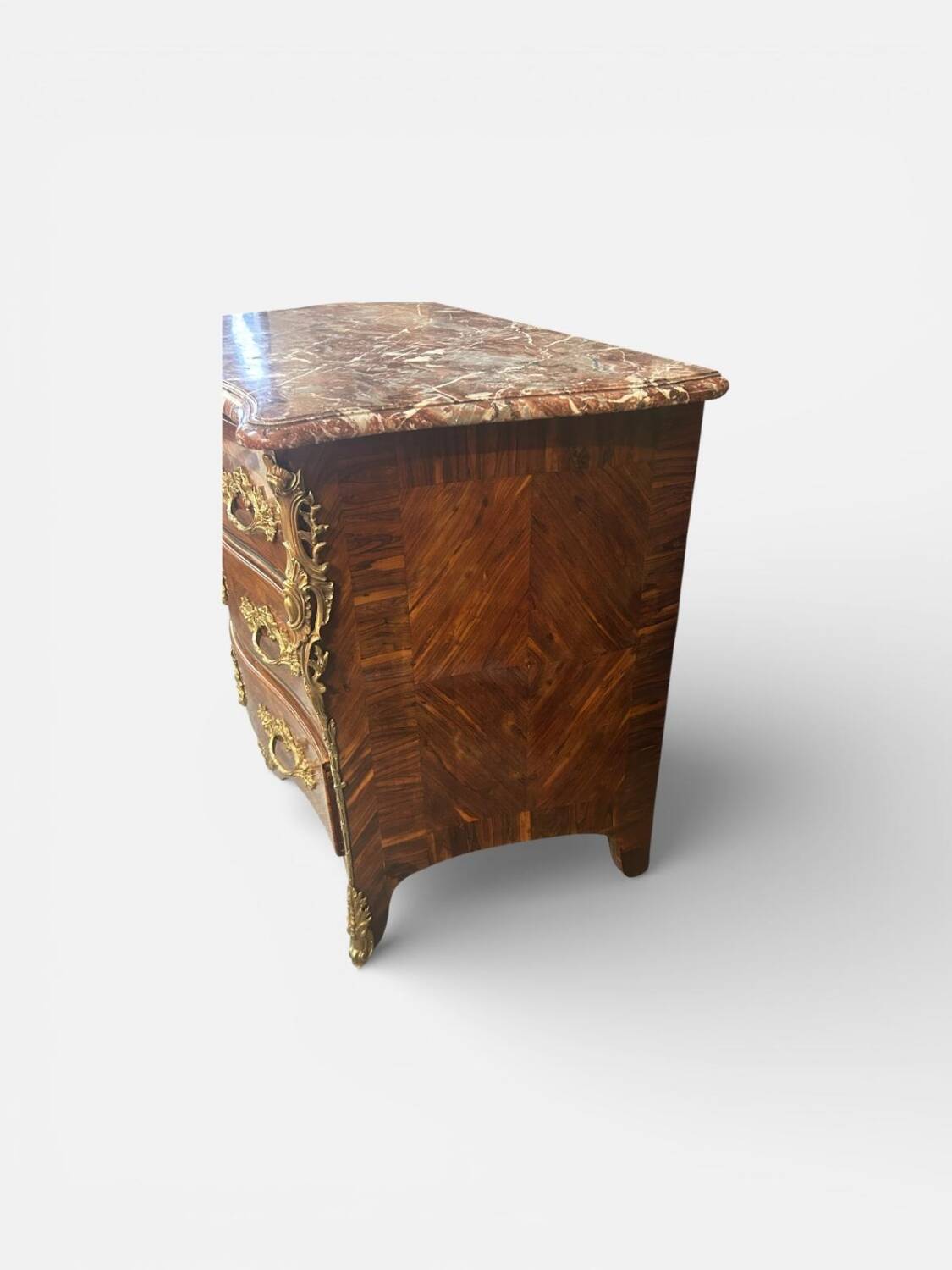 Louis XV period commode with violet wood veneer.