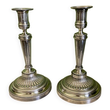 Pair of silvered bronze candlesticks in the Louis XVI style signed Voisenet, 19th century.