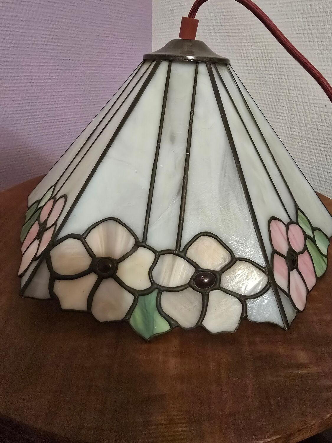 Tiffany-style stained glass lampshade with floral motifs.