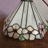 Tiffany-style stained glass lampshade with floral motifs.