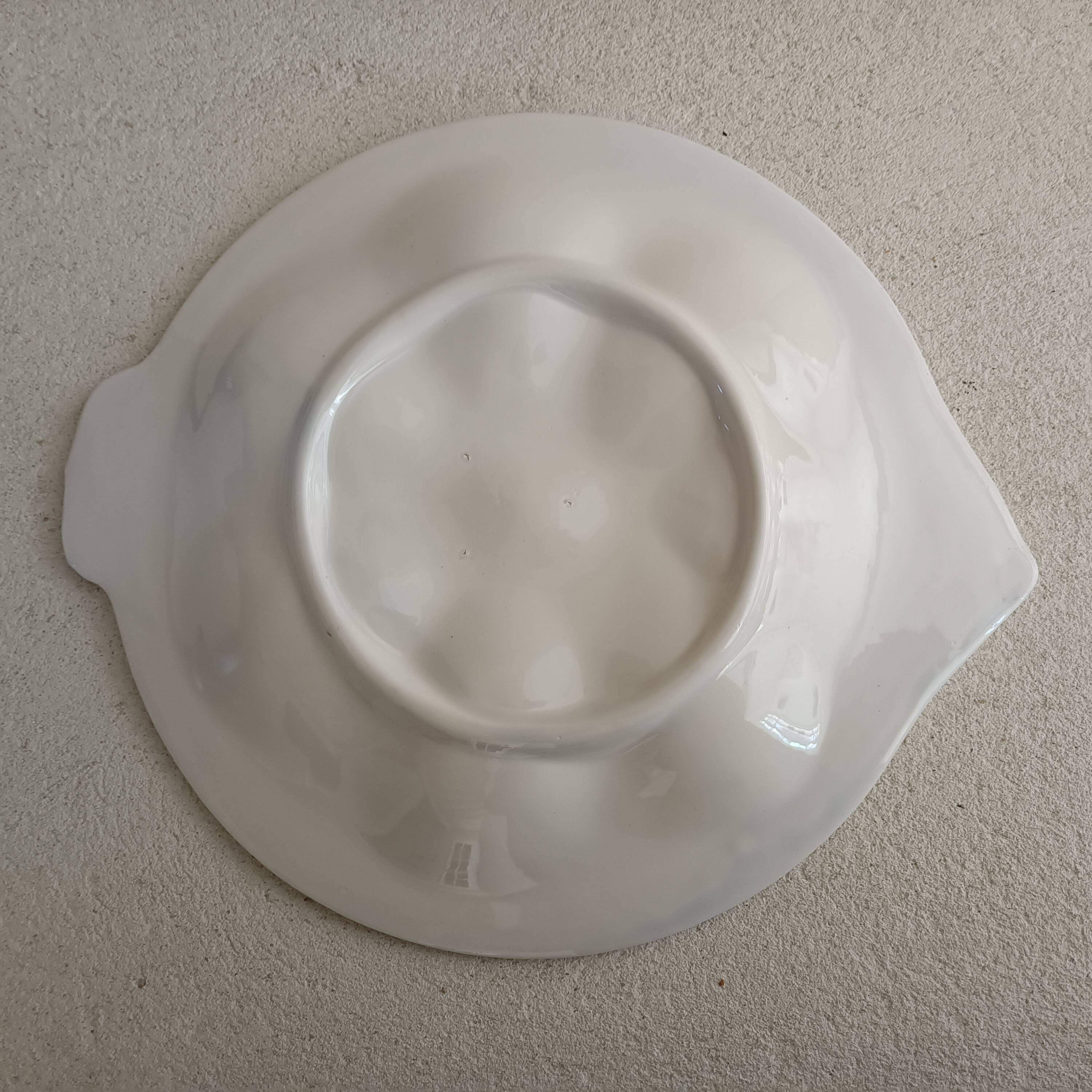 Vintage oyster plates in the shape of a sole.