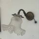Antique bronze wall light in Louis XVI style - tulip-shaped glass paste flower.