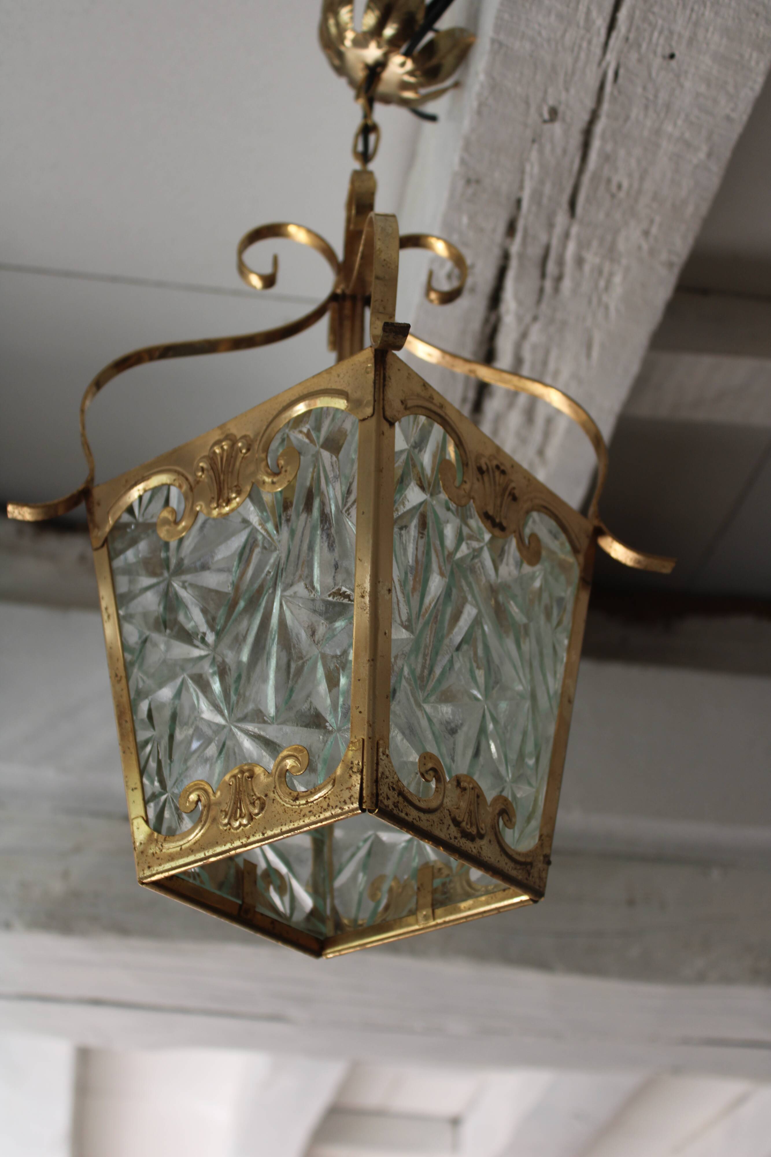 Glass and brass suspension