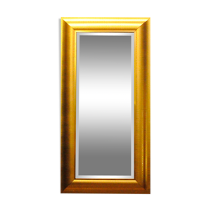 Large mirror in a golden decorative