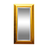 Large mirror in a golden decorative frame
