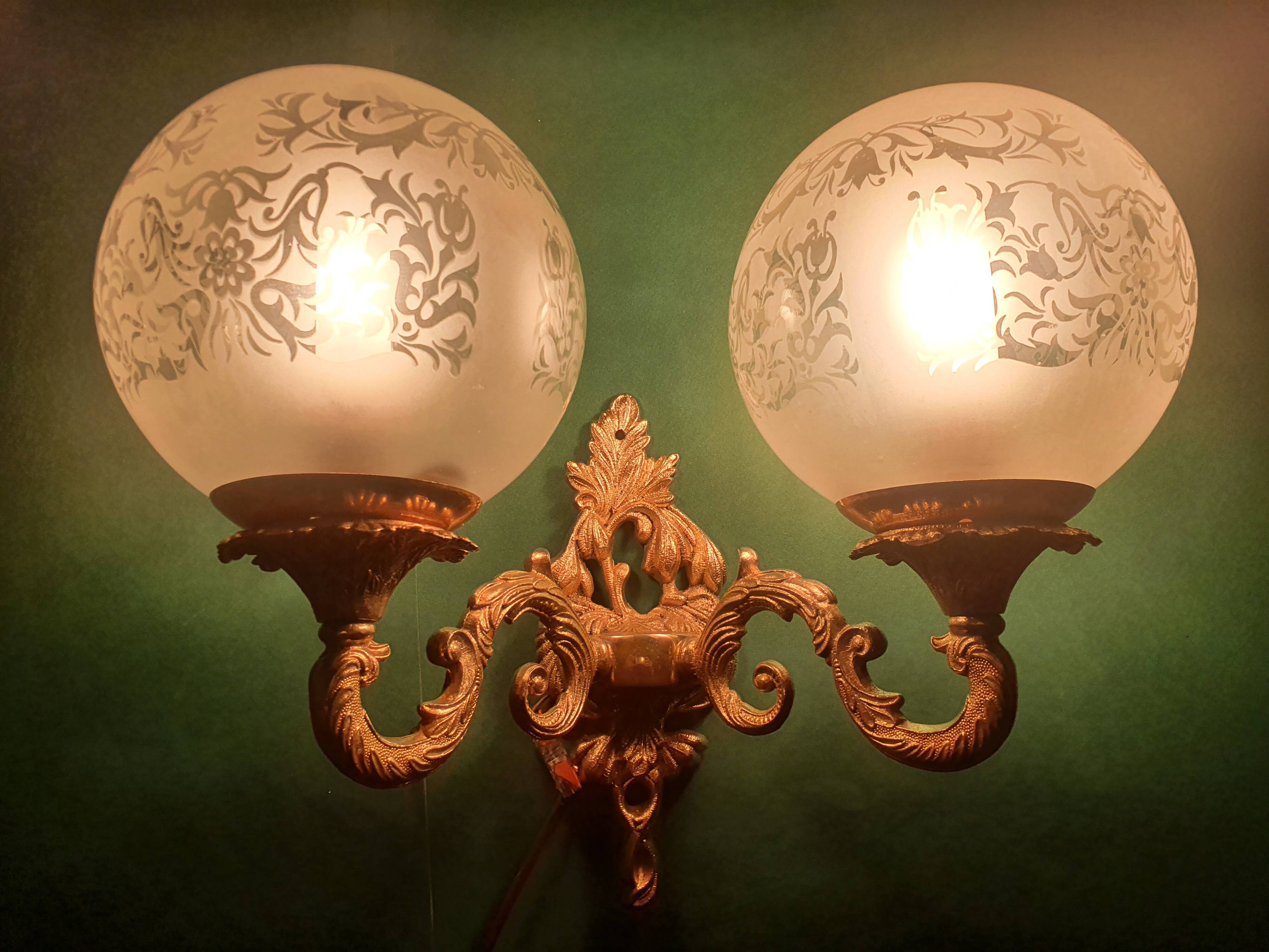 Pair of large double-light wall sconces in vintage brass and glass