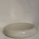 Empty pocket, cracked ceramic dish 1980