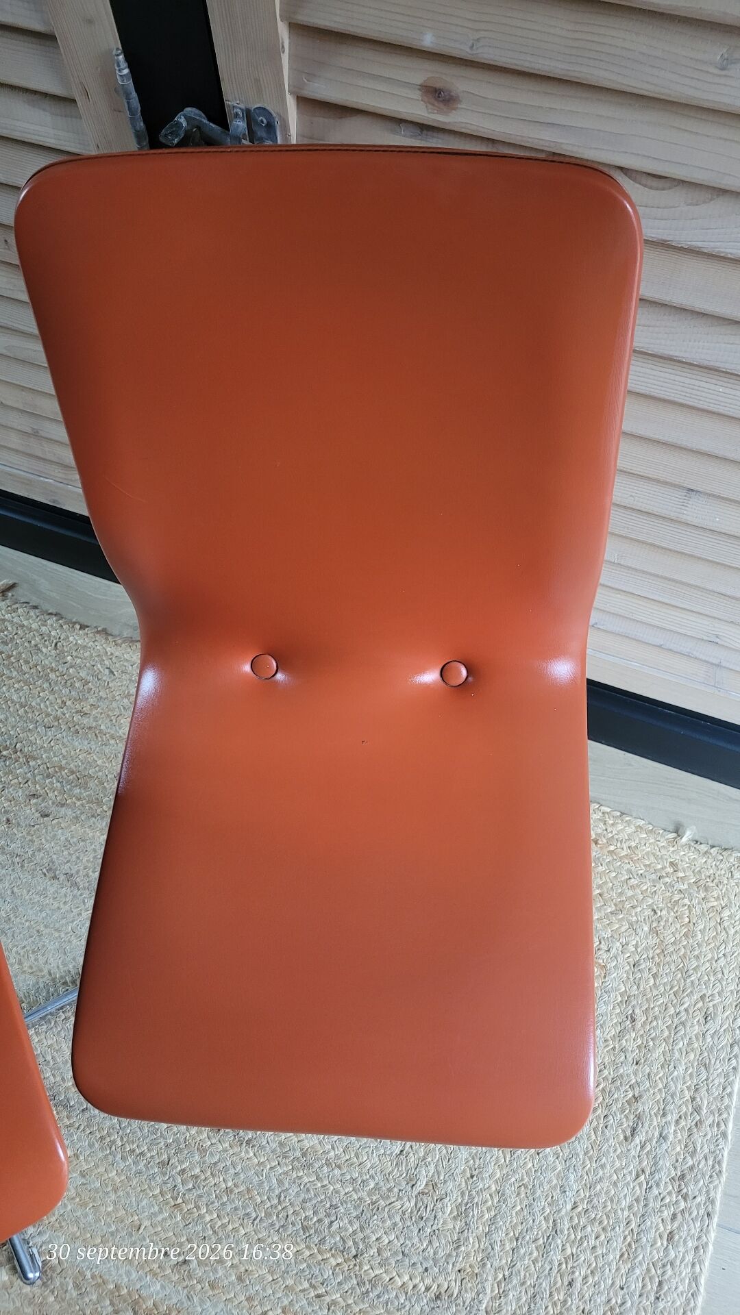 2 orange faux leather swivel chairs