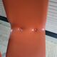 2 orange faux leather swivel chairs