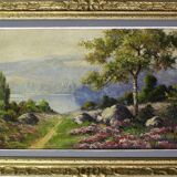 large painting of lake and countryside