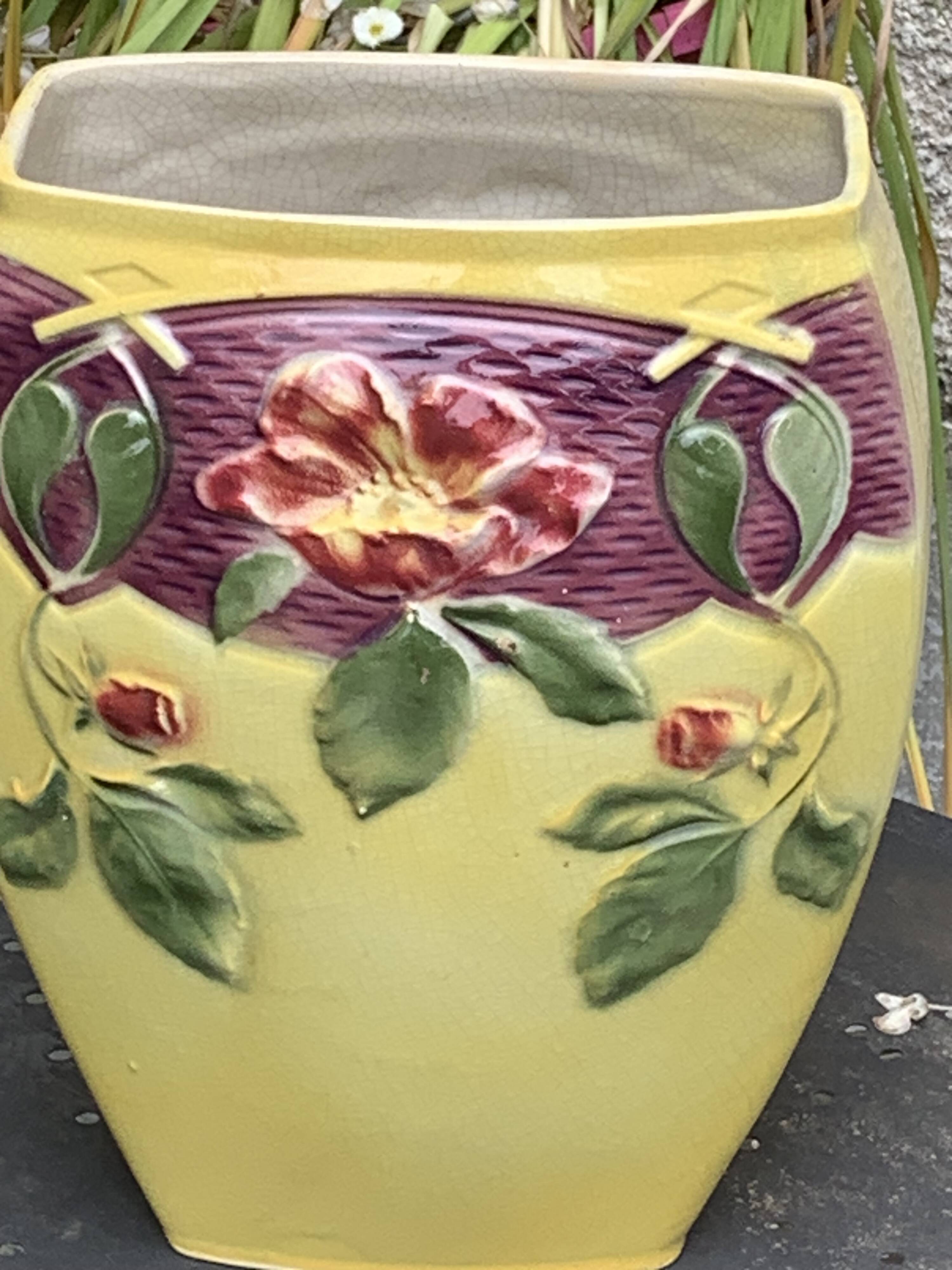 Yellow glazed ceramic slip vase with hawthorn pink flower motif