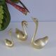 Swans or ducks brass