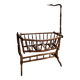 Wooden cradle in walnut with a sign collar at the top.