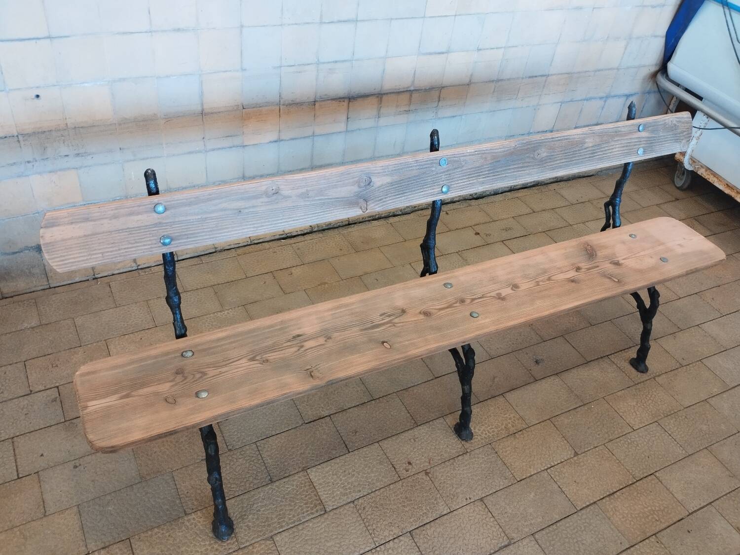 Antique garden bench with cast iron legs