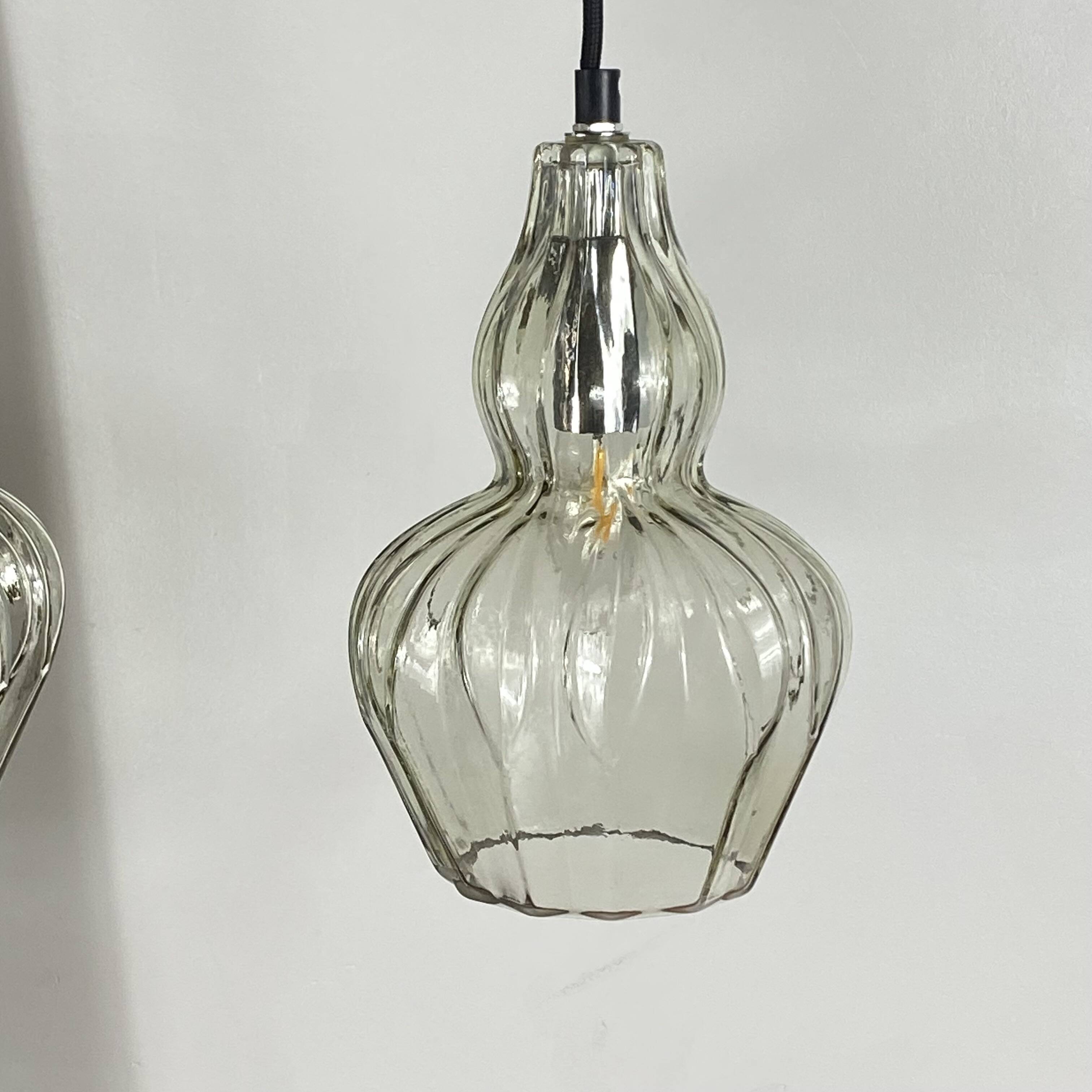 Pair of vintage glass pendant lights.