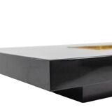 Willy Rizzo. Low table in black lacquered wood and gold brass. 1970s.