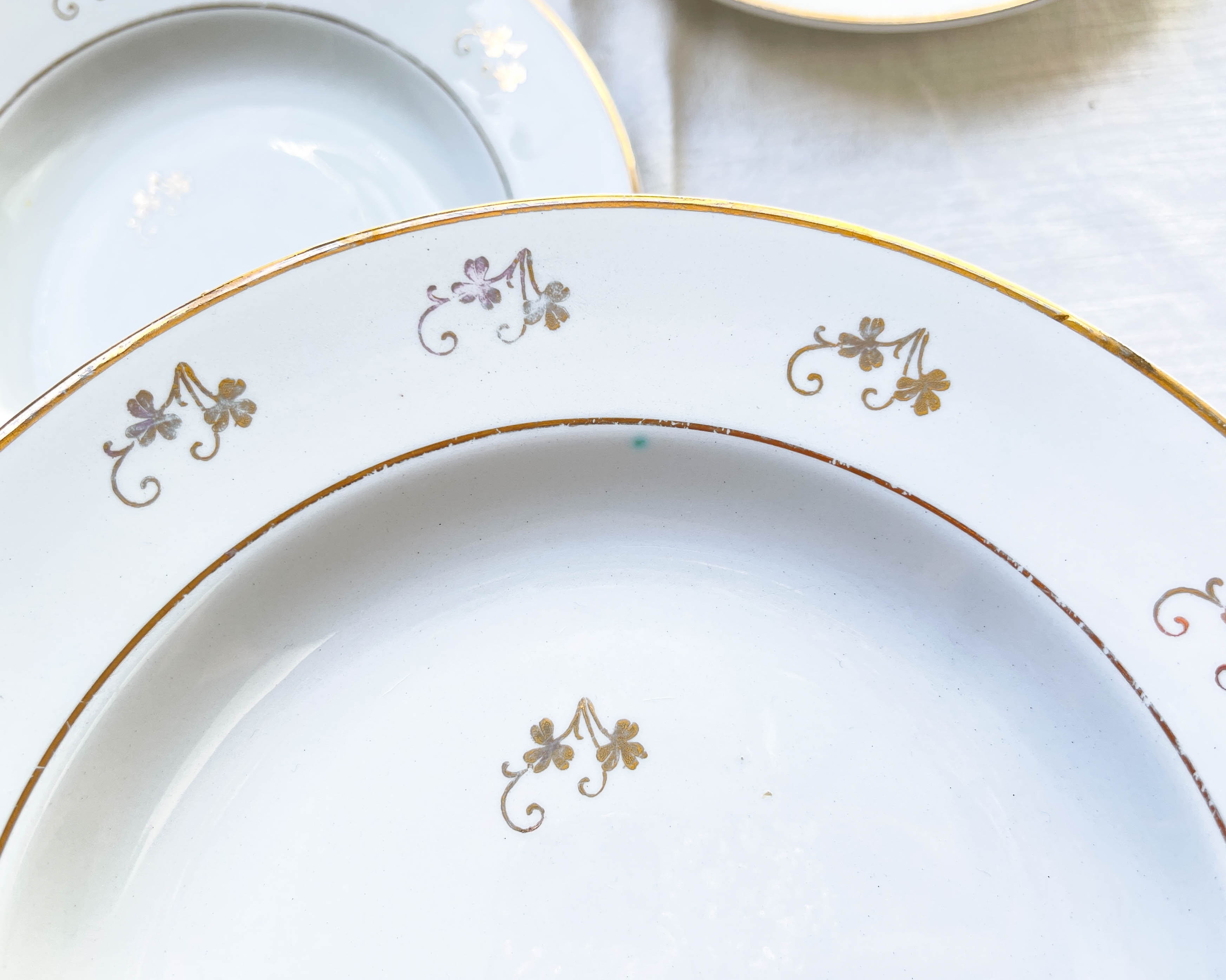4 white porcelain L'Amandinoise soup plates with gold floral pattern