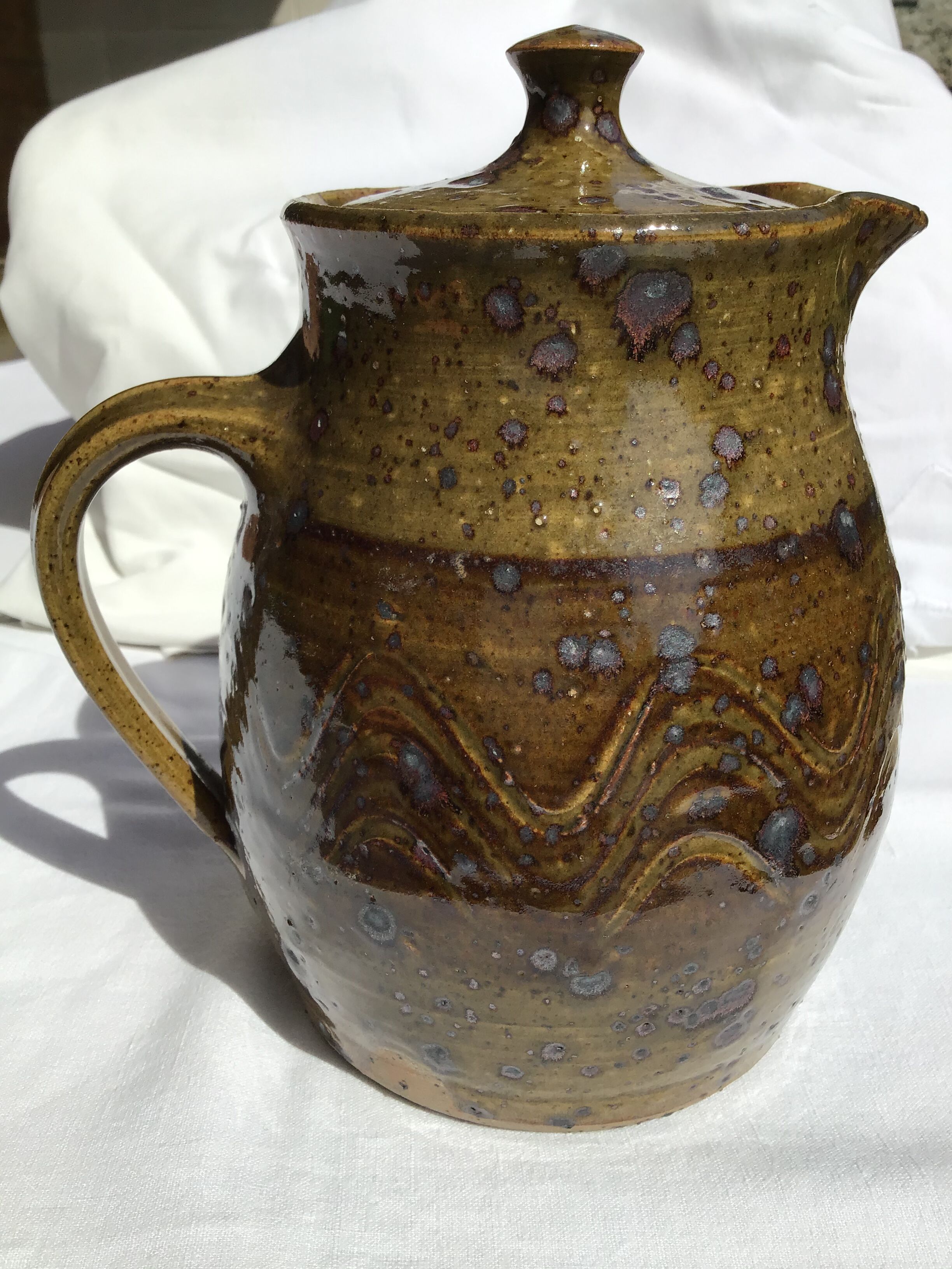 Signed olive green pyrity sandstone tea