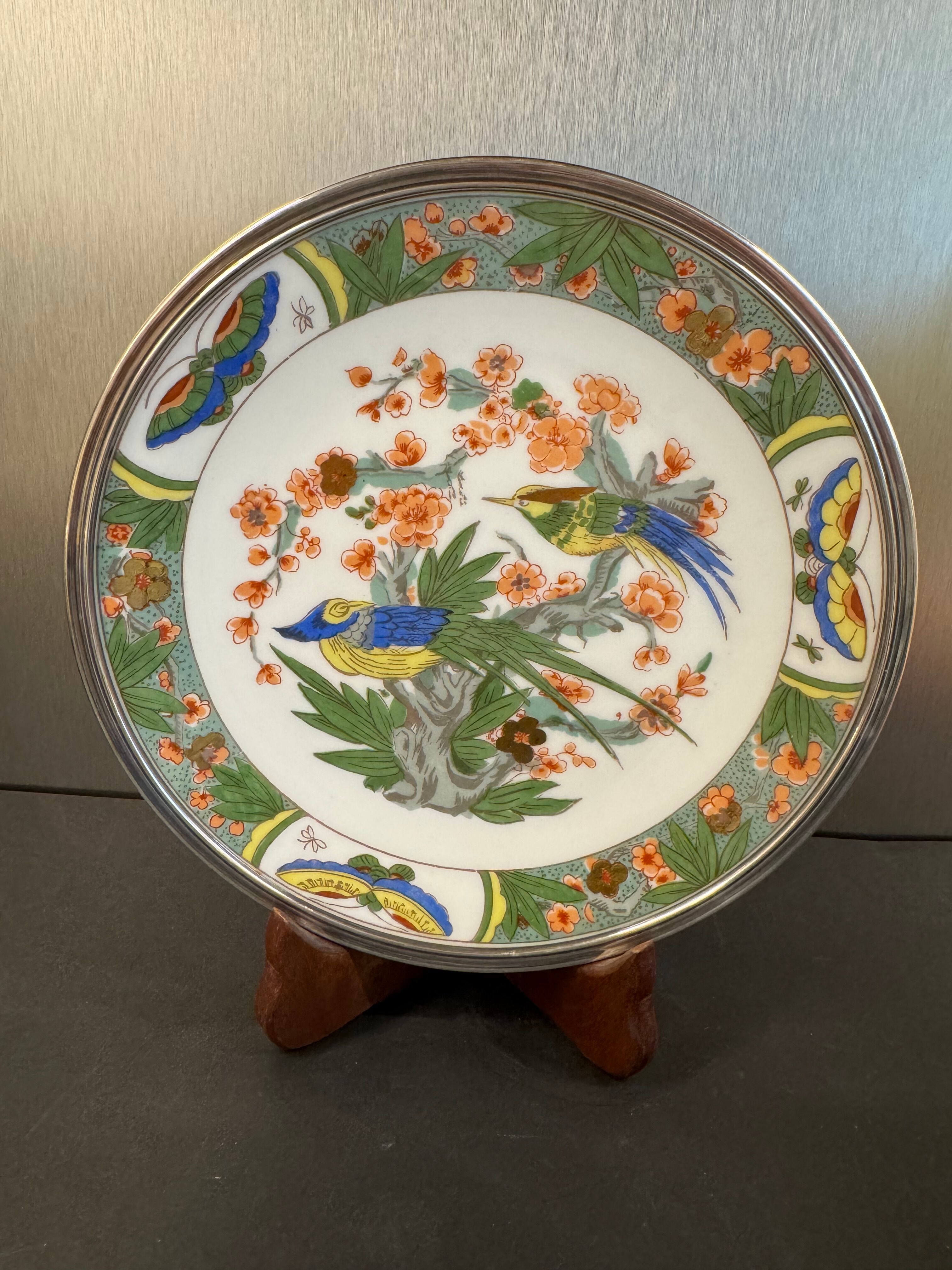 Two Raynaud Limoges plates and Tetard brothers silver.