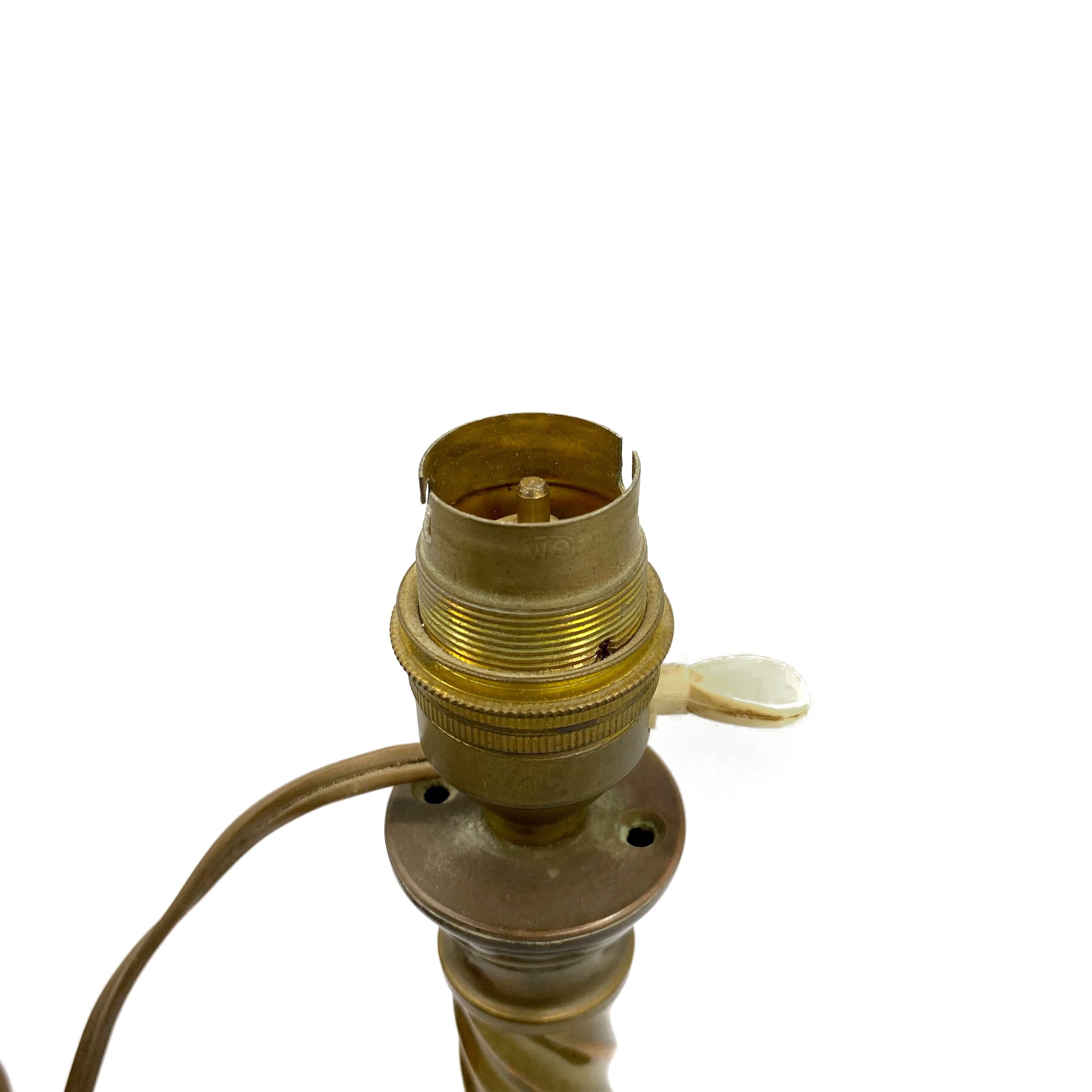 Repelled brass bedside lamp