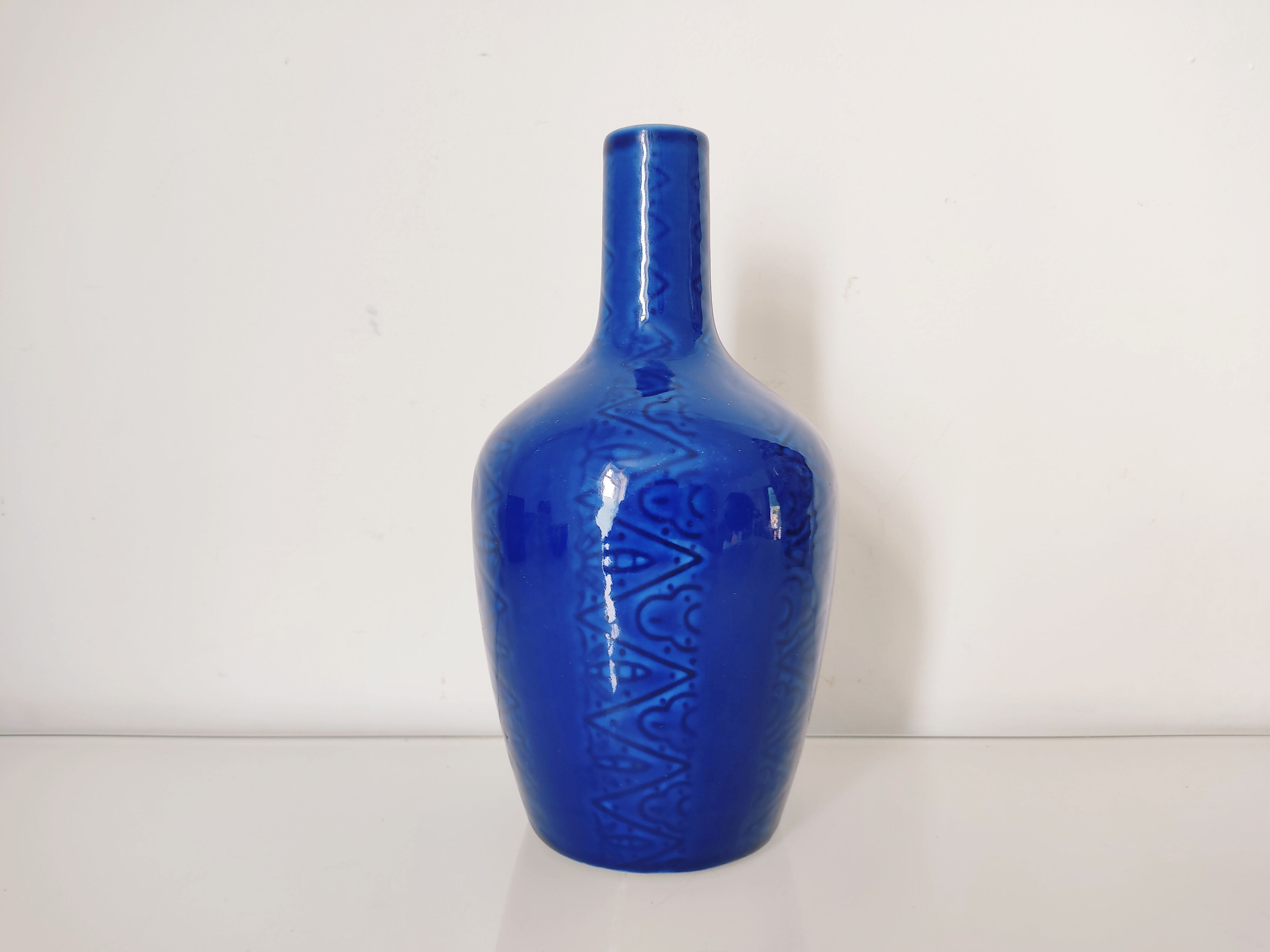 Blue vase geometric incised decoration