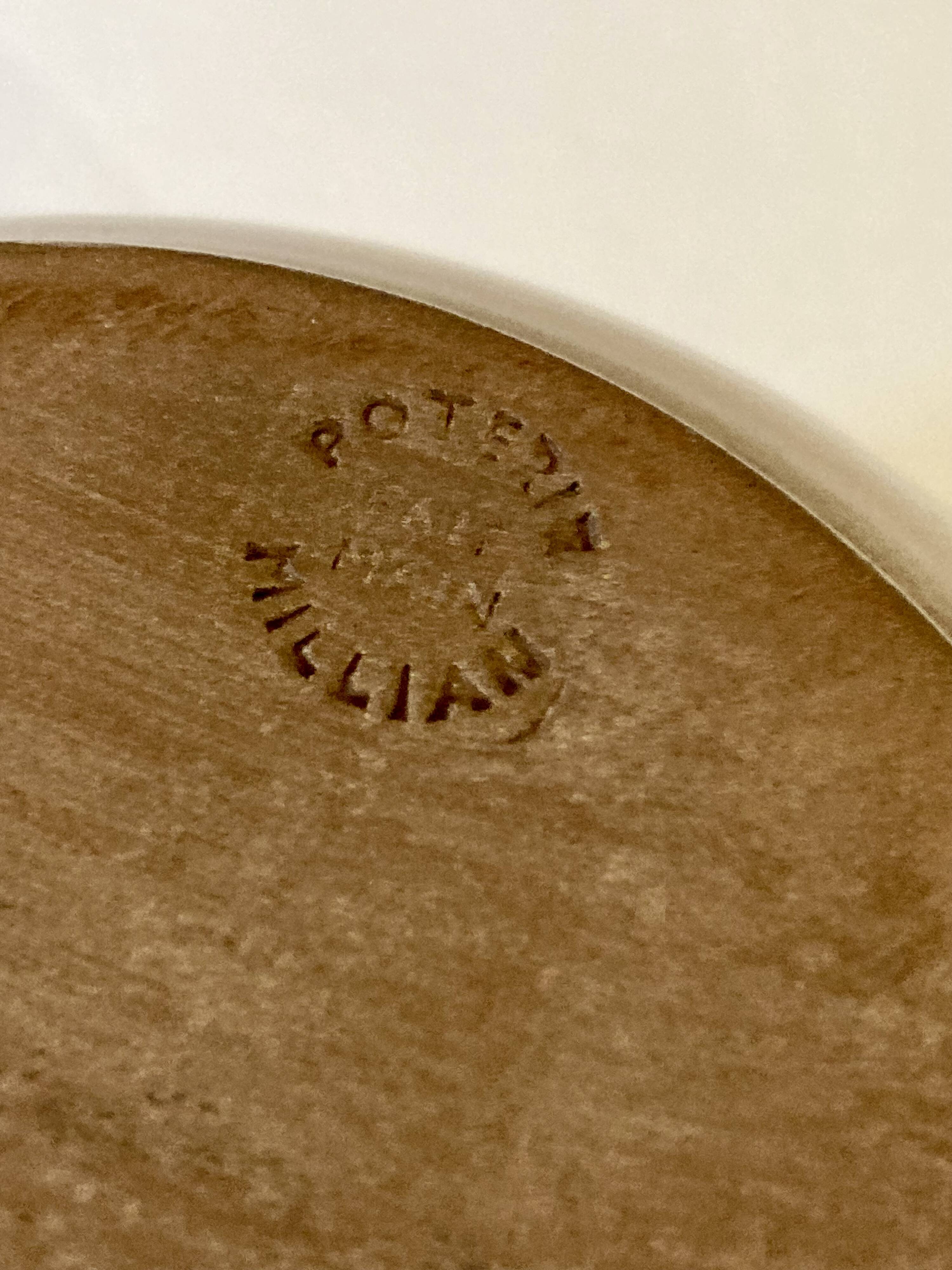 Vase with flowers in glazed ceramic