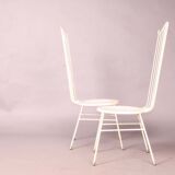 Two white metal chairs