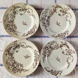 4 assiettes plates en terre de fer marron à décor d'oiseaux