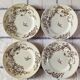 4 assiettes plates en terre de fer marron à décor d'oiseaux