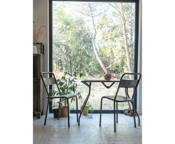 Pair of patinated metal chairs