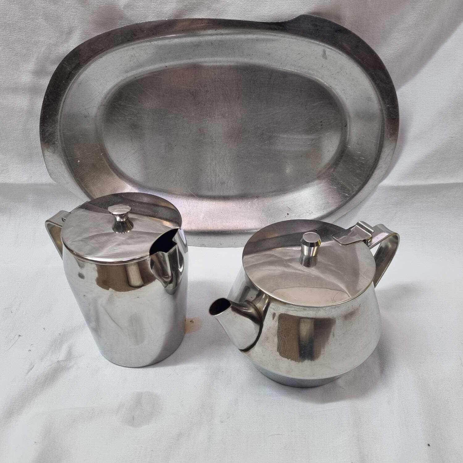 Stainless steel teapot and coffee pot from a boat, 1960