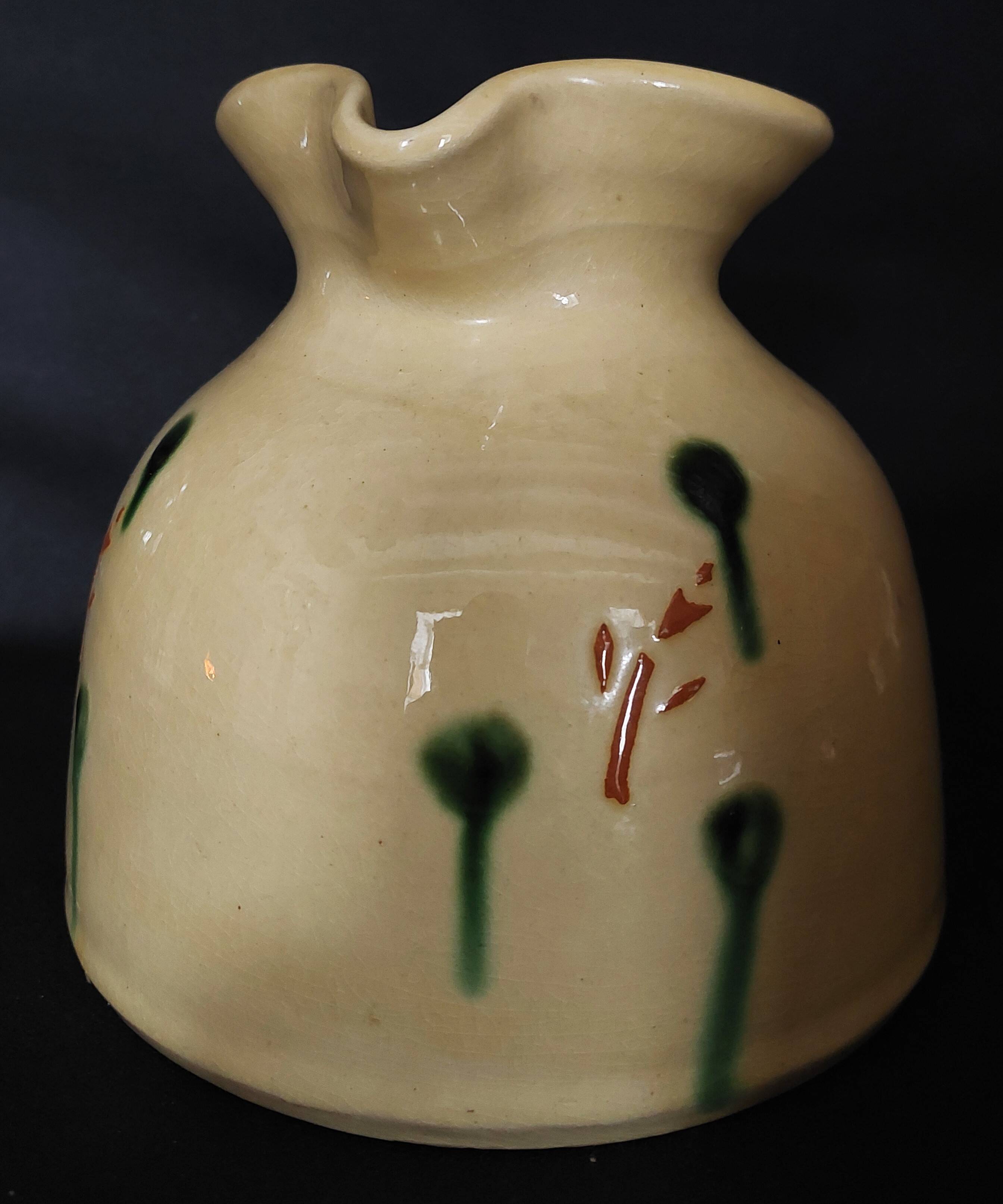 Vintage glazed terracotta ceramic jug from the 20th century.