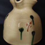 Vintage glazed terracotta ceramic jug from the 20th century.
