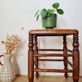 Wooden stool with cane seat