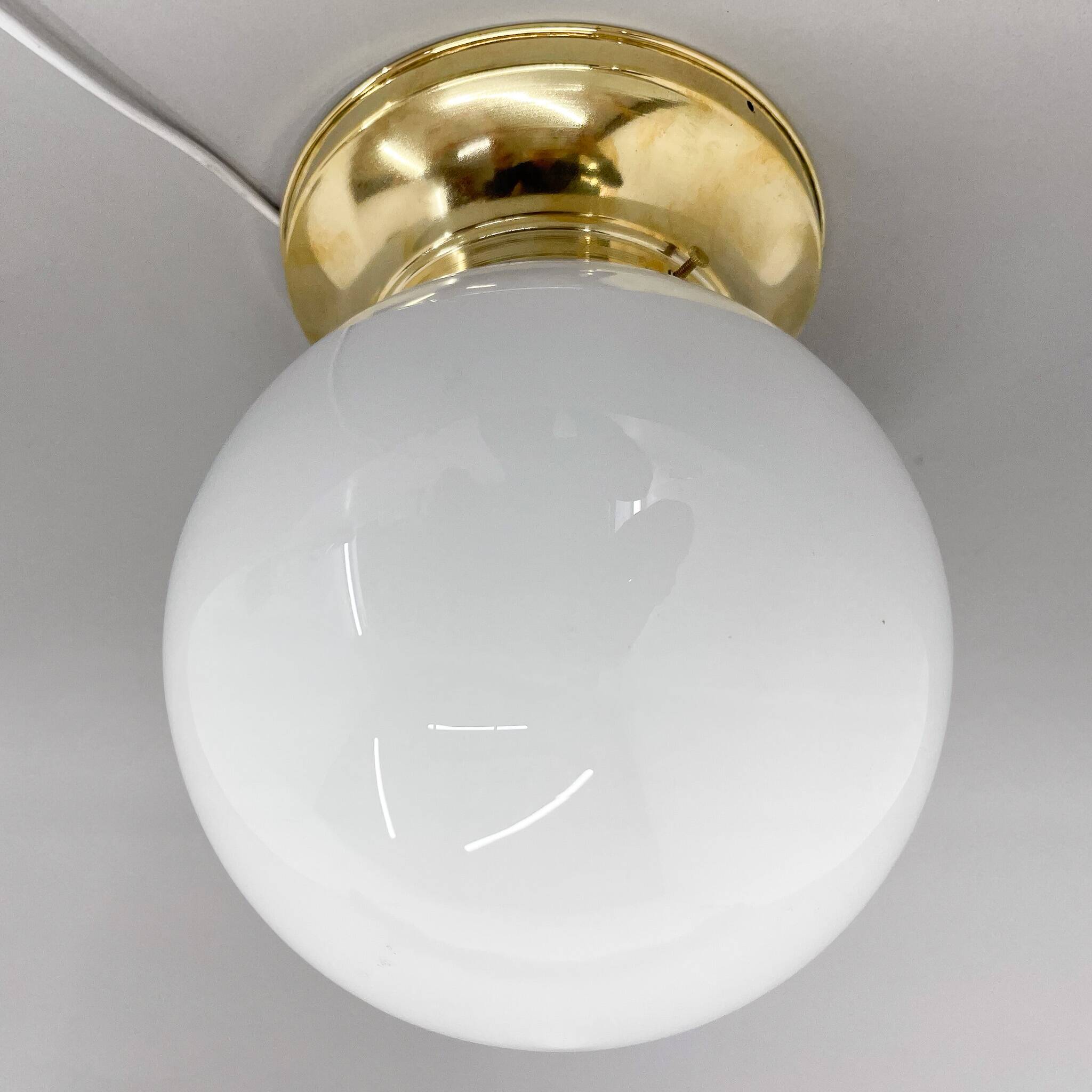 Set of three mid-century brass and milk glass ceiling ligts, restored