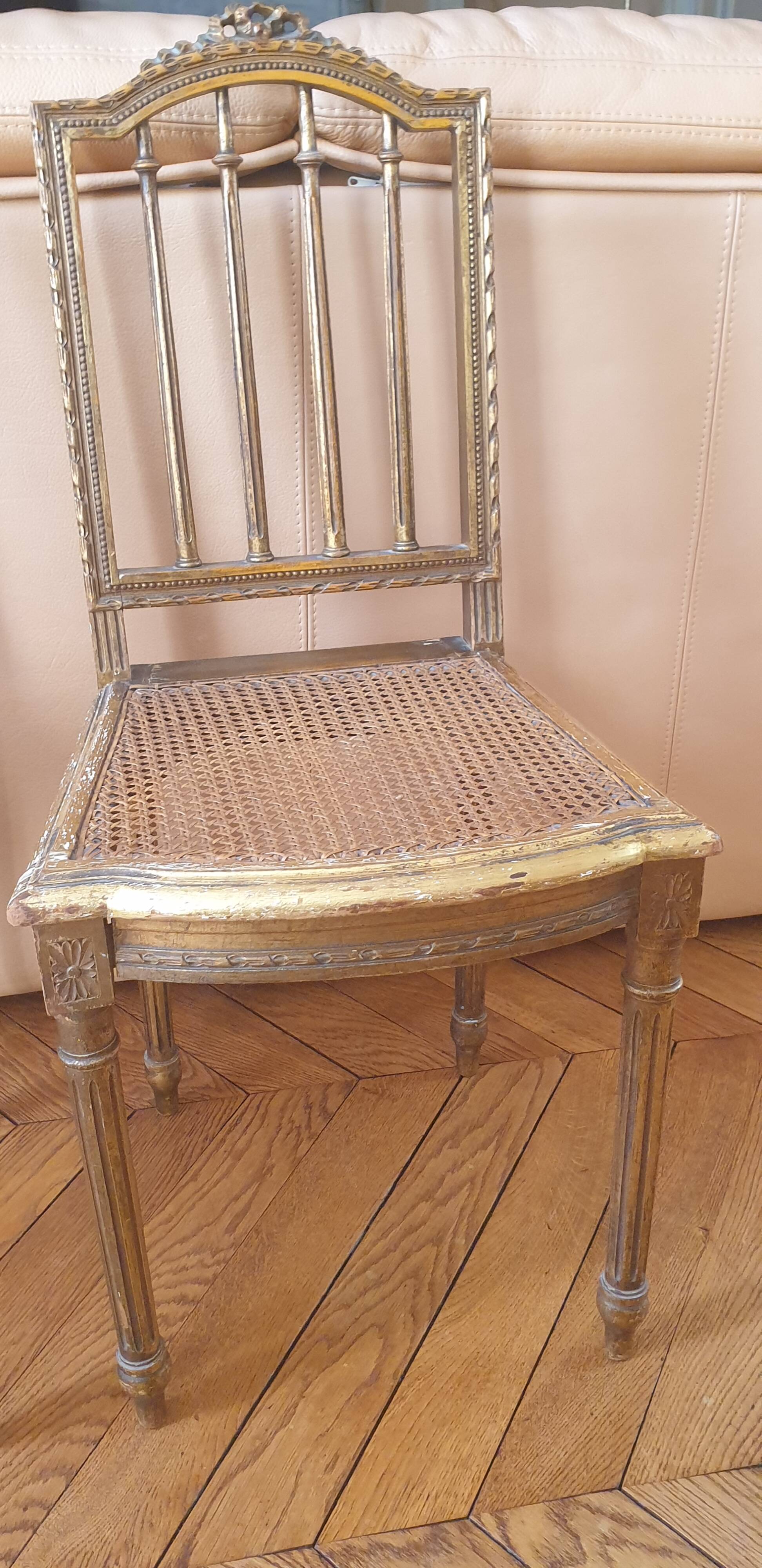 Pair of Louis XVI caned chairs with carved gilded wood.