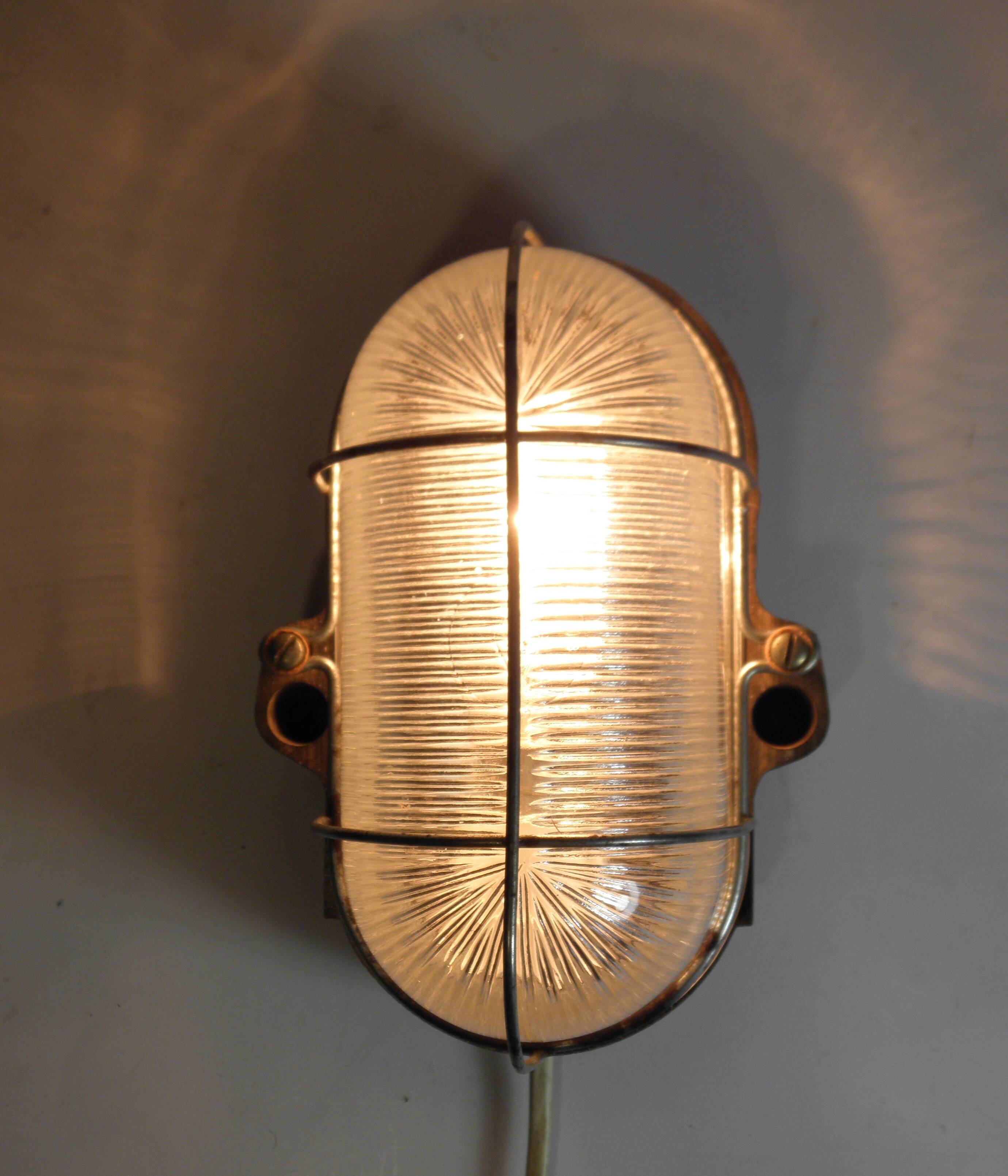 Glass and Bakelite wall light from the 1950s.