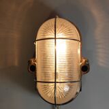 Glass and Bakelite wall light from the 1950s.