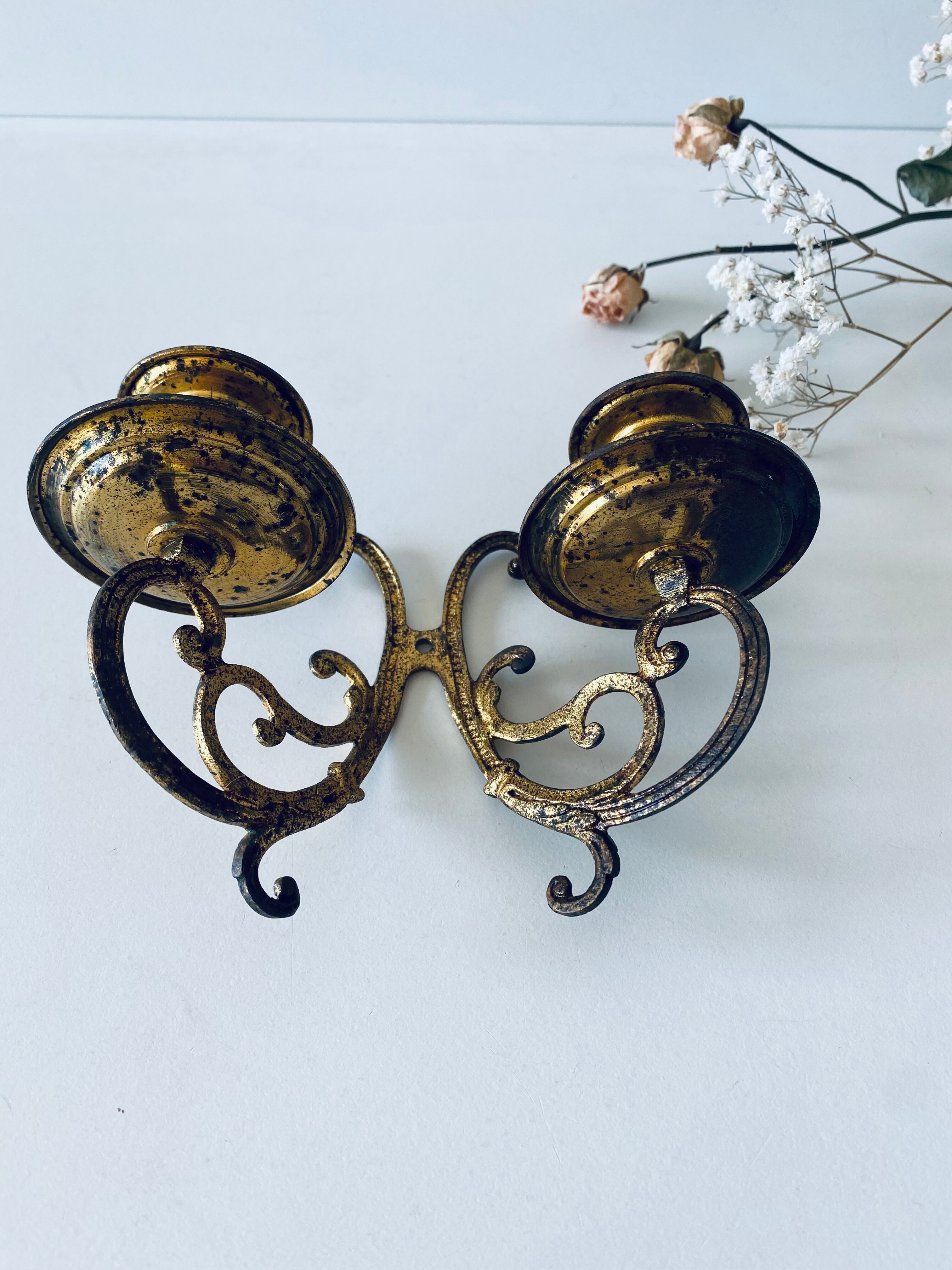 Old wall candle holder in golden brass