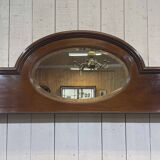 English mahogany shelf with its bevelled mirror from the early 20th century.