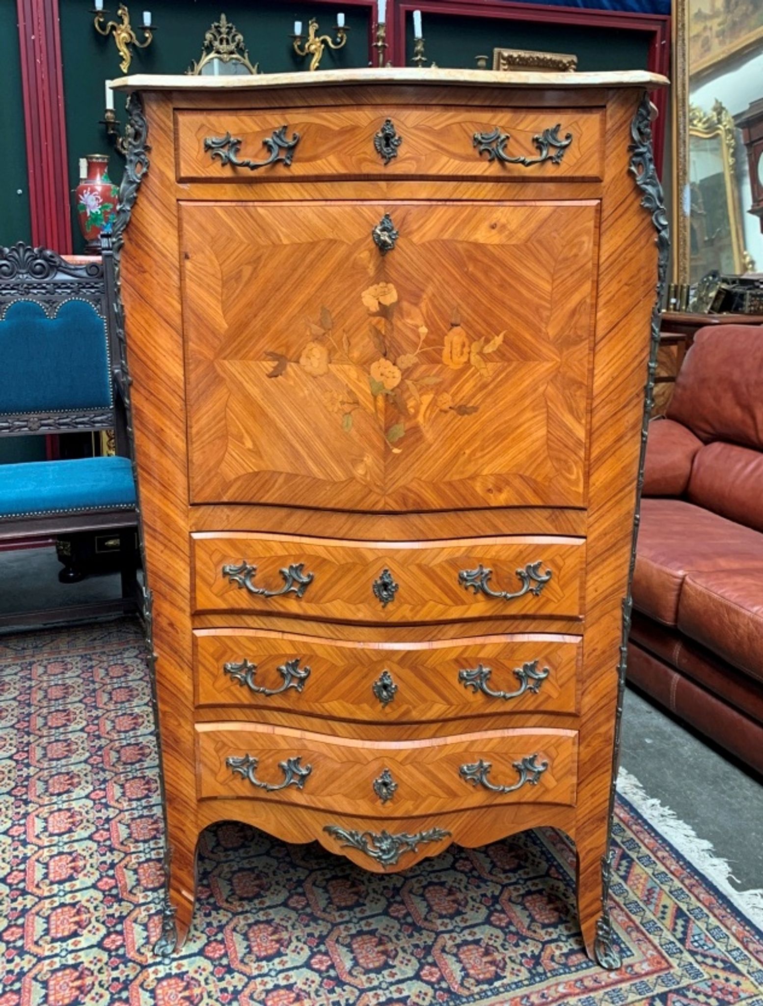 Old French secretary in bronze and wood marquetry.