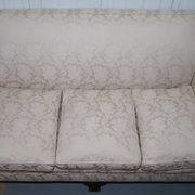 Victorian suite in damask, walnut frame, legs carved in lion's paw.