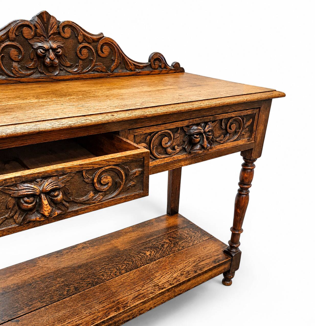 Victorian Gothic Oak side table, decorative carved round 1920. Green Mask decoration