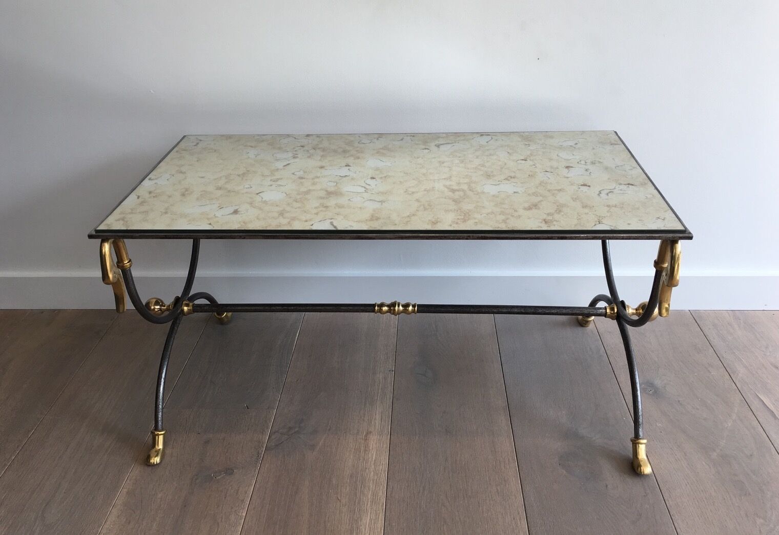 Coffee table in brushed steel and brass