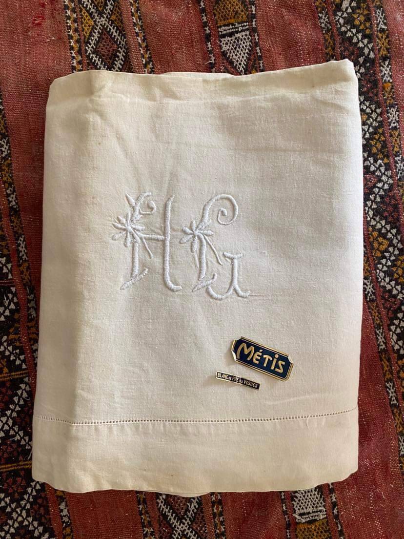 Drap en metis monogramme HG.