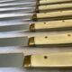 Series of 12 serrated vintage table knives