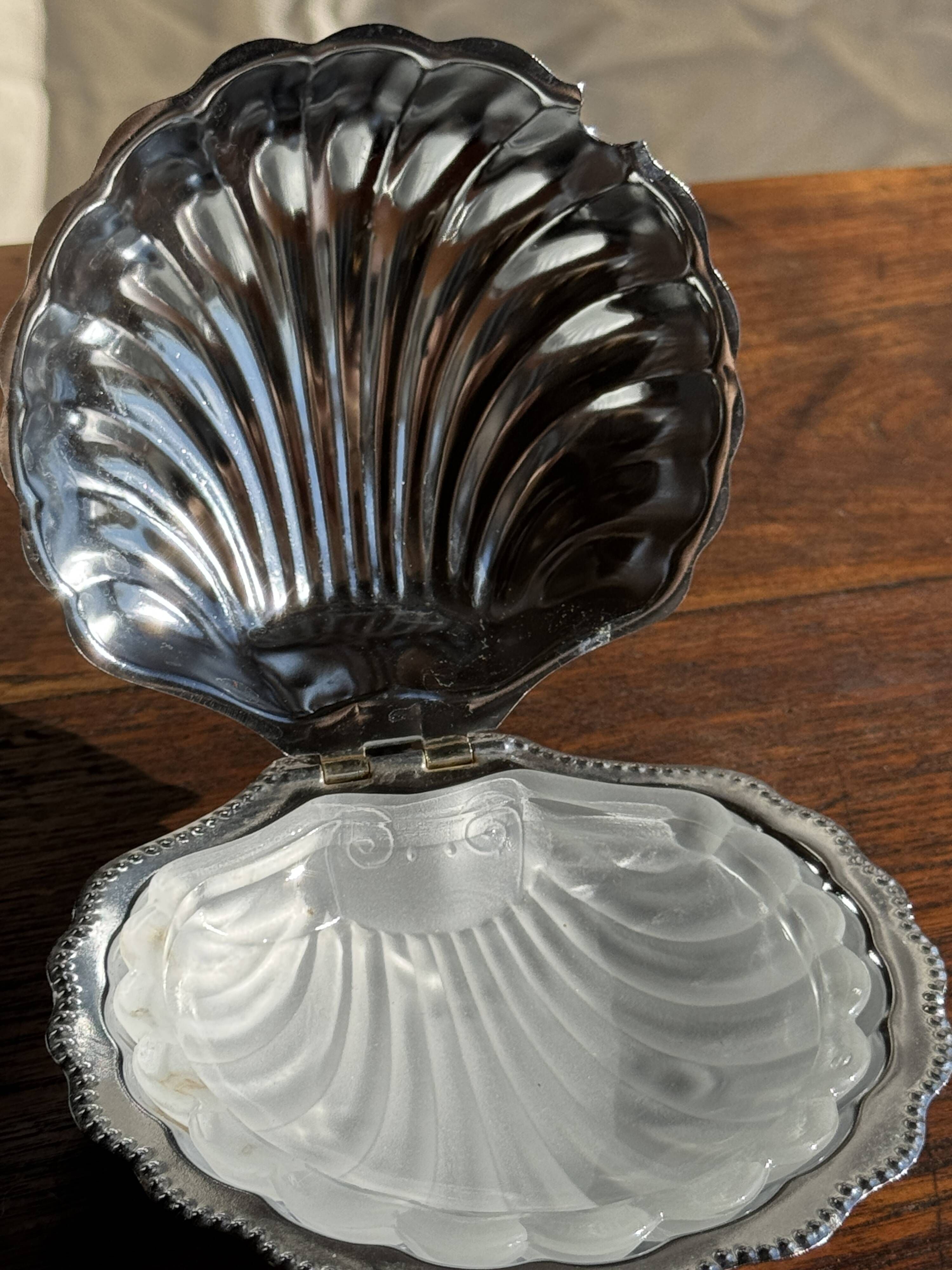 Vintage silver-plated shell butter dish with transparent bowl.