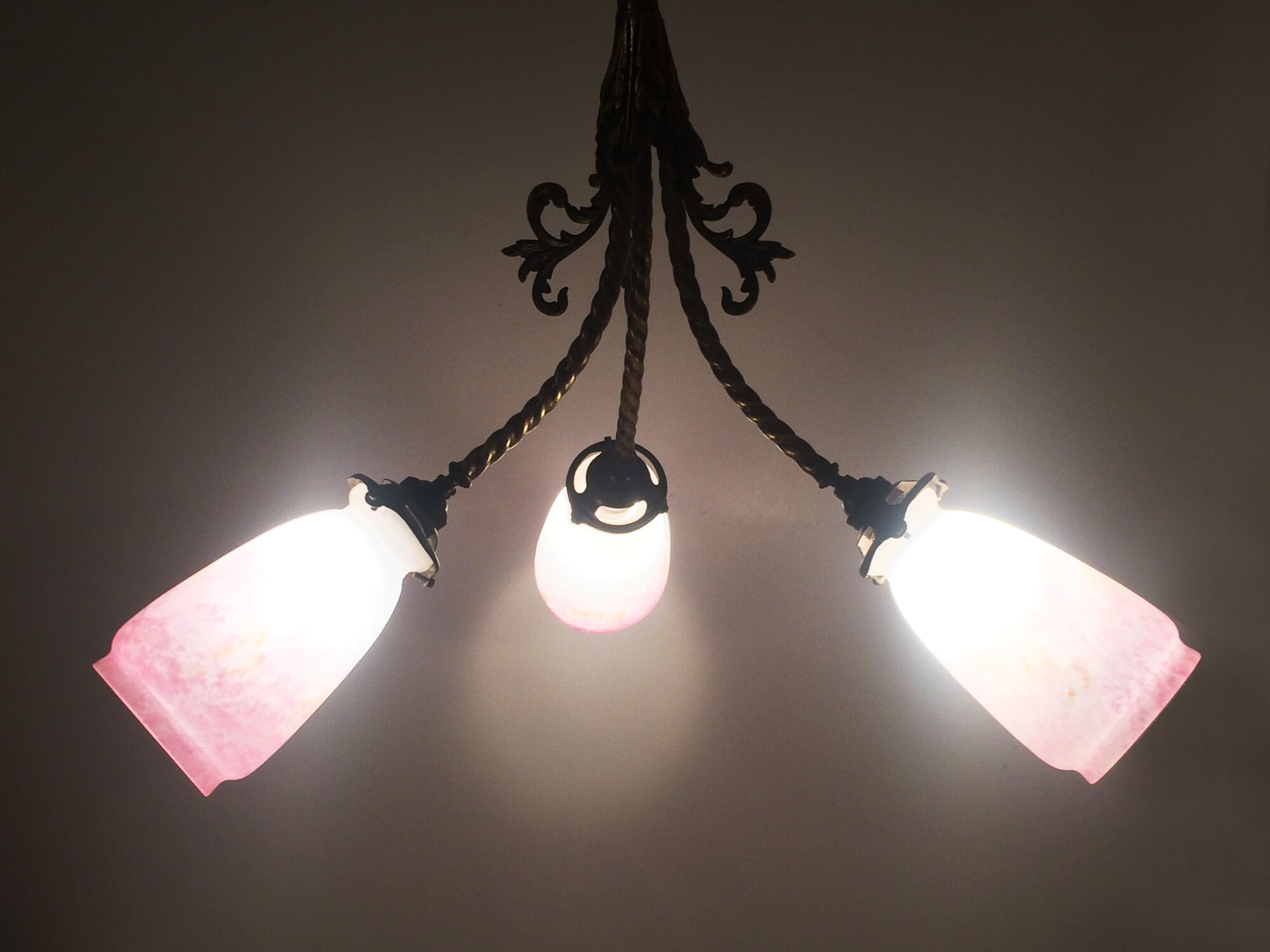 Art Deco chandelier in bronze with 3 tulips in pink glass paste. Signed L'Elf