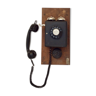 Old wooden wall phone in bakelite